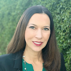 Cindy Parnell headshot - fair-skinned woman, smiling, brown hair, teal shirt, navy blazer, necklace