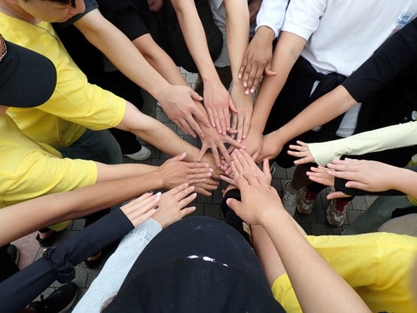 Hands coming together