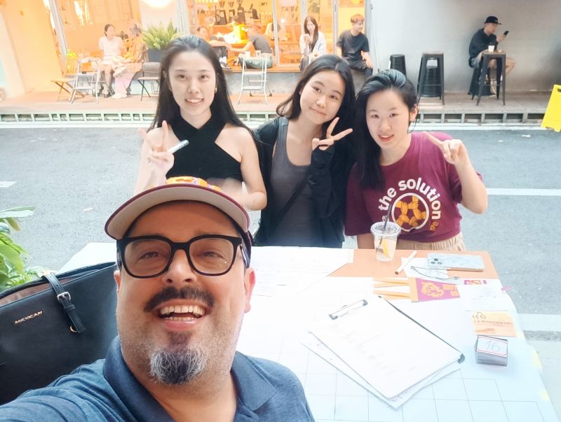 Fellow HAIC students meet at research table while conducting fieldwork.
