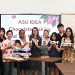 Group picture of HAIC students holding up chocolate and tea