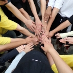 Hands coming together